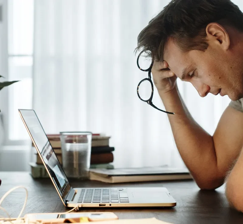 Man Confused Looking At Paternity Test Results Online Laptop