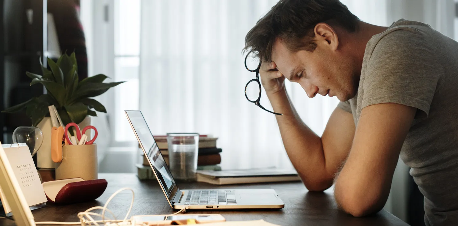 Man Confused Looking At Paternity Test Results Online Laptop