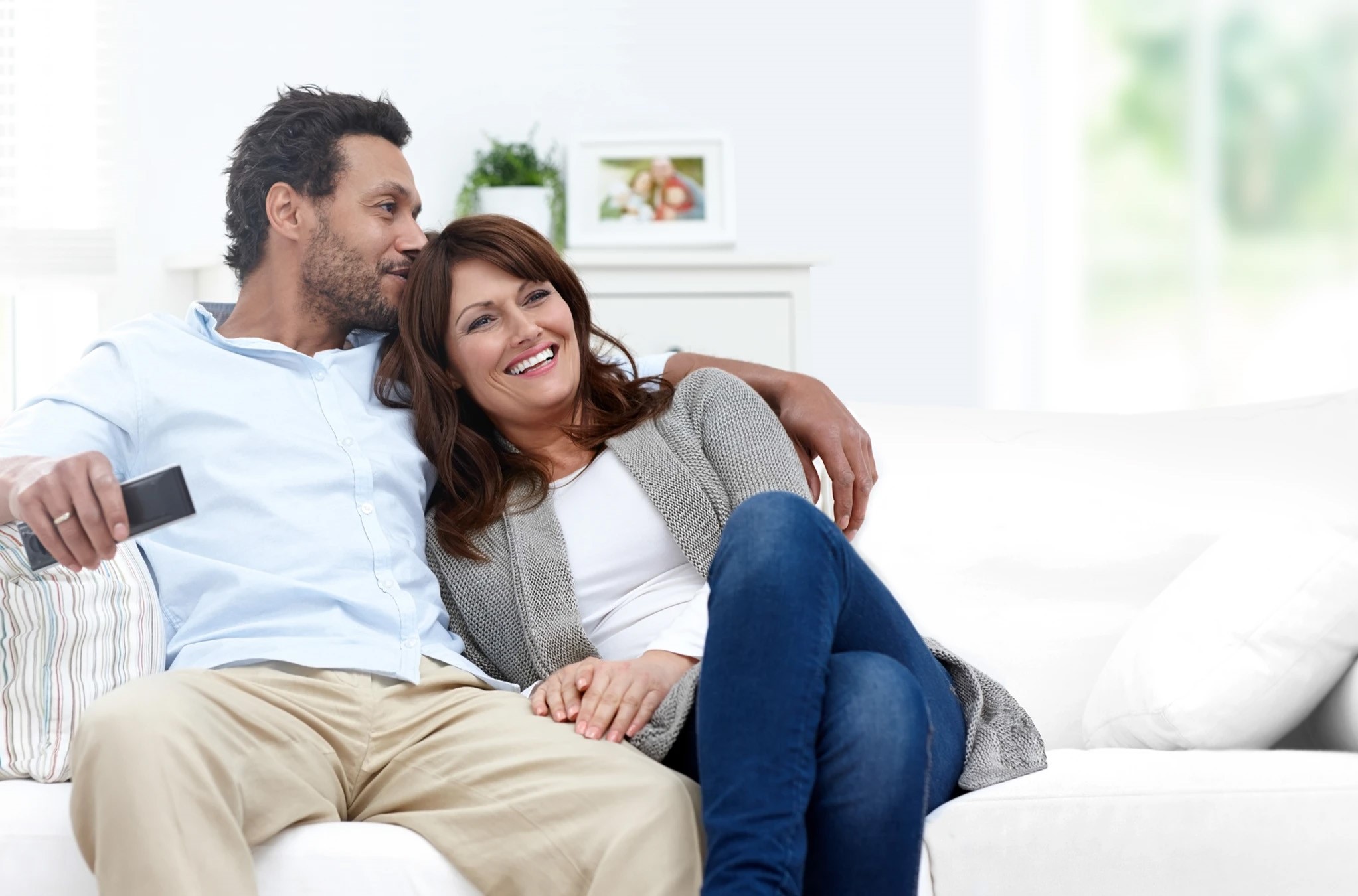 happy couple on couch